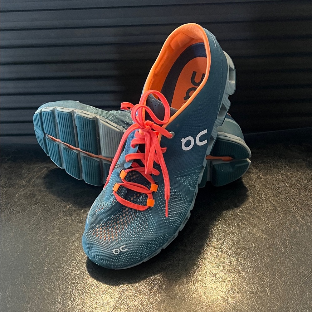 On Running Men's Athletic Shoes in Blue and Orange, size 11, good condition.